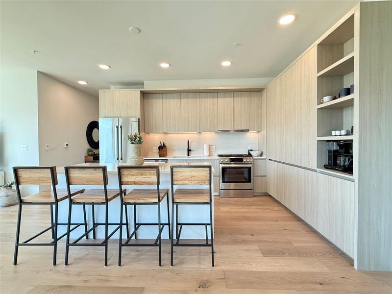 Culinary aspirations find their home in this light-filled kitchen, boasting ample counter space and integrated storage.
