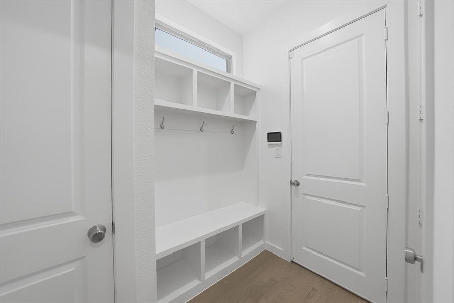 Mudroom featuring dark wood finished floors