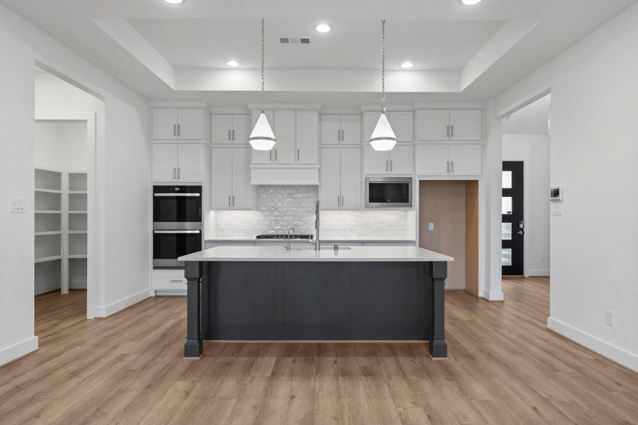 Large island that is great for entertaining and an abundance of floor to ceiling cabinetry. Large island that is great for entertaining and an abundance of floor to ceiling cabinetry.