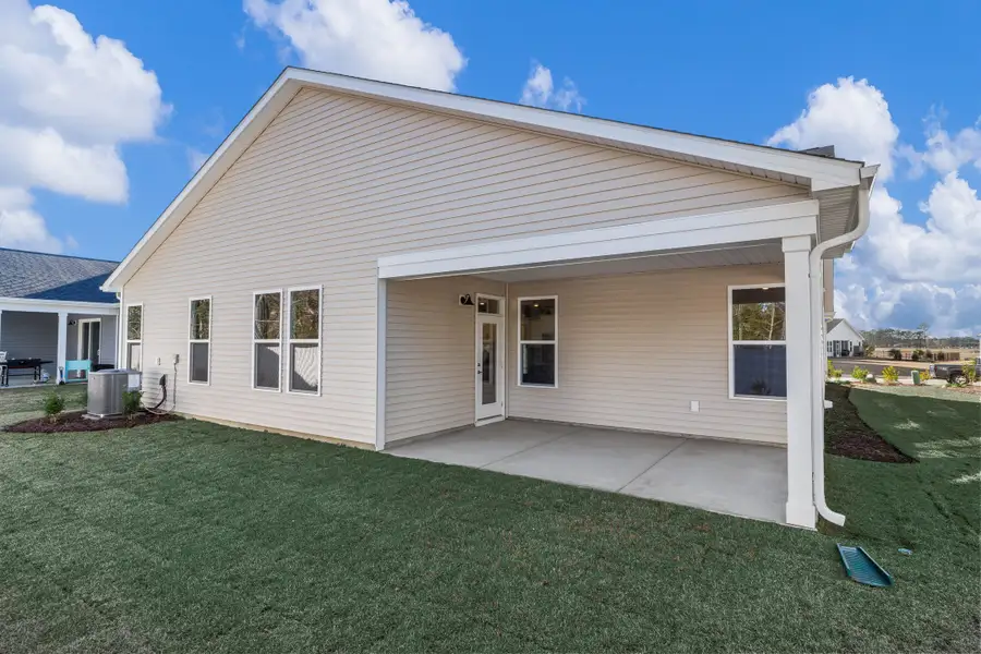 Exterior details and patio area of a home in Coastal Club of the Carolinas, Calabash (Image 3).