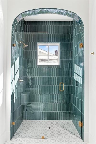 Full bath featuring a shower stall and baseboards Full bath featuring a shower stall and baseboards