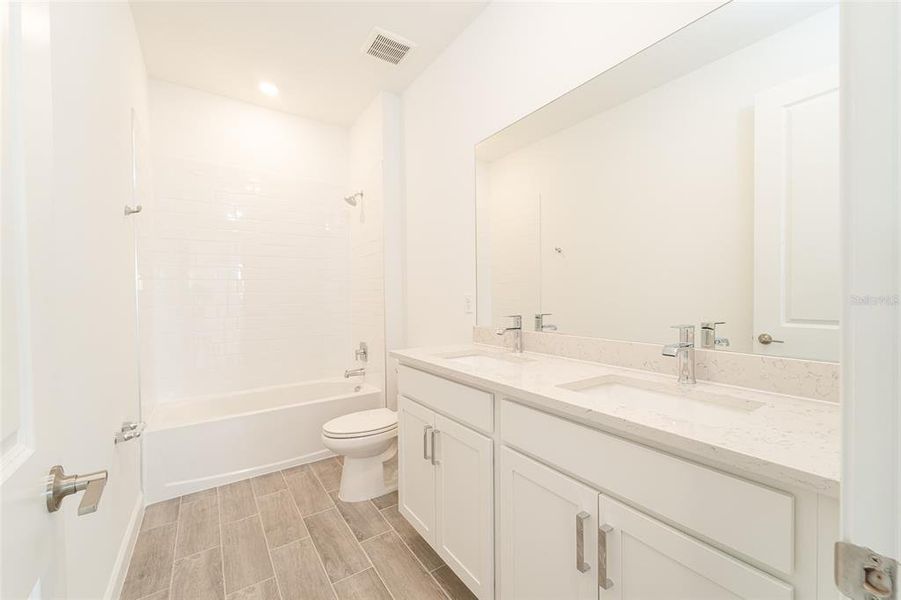 Furnished interior view inside a new home in Tesoro Club, Port St. Lucie (Image 9).