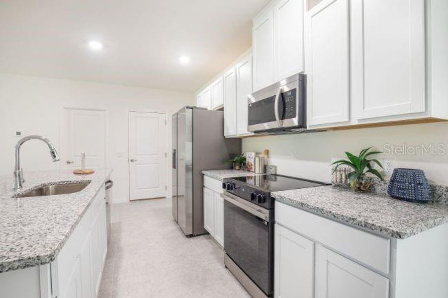 Furnished interior view inside a new home in Coastal Communities, Edgewater (Image 11).