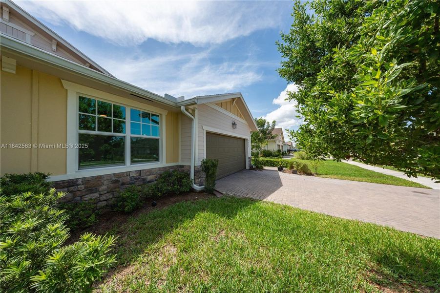 Front exterior of a new home in , Loxahatchee, FL, highlighting curb appeal (Image 28).