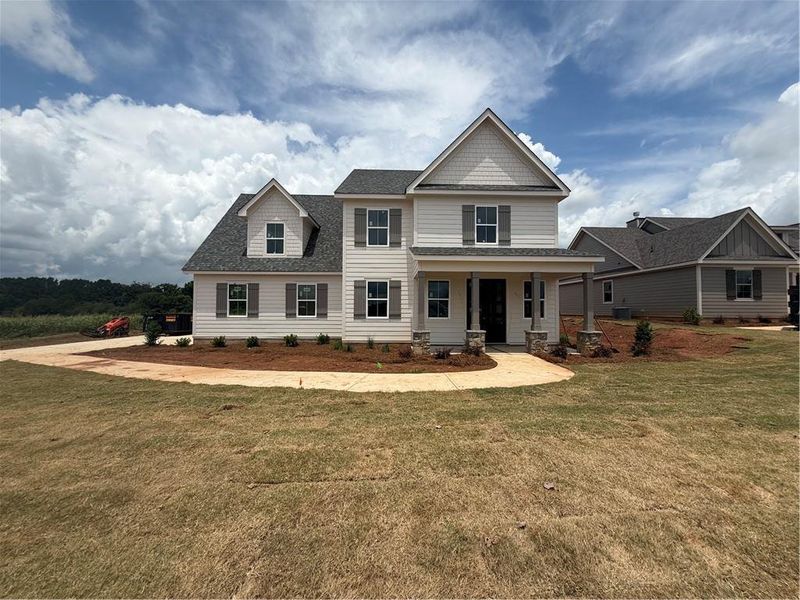 Front exterior of a new home in , Madison, GA, highlighting curb appeal (Image 1). Front exterior of a new home in , Madison, GA, highlighting curb appeal (Image 1).