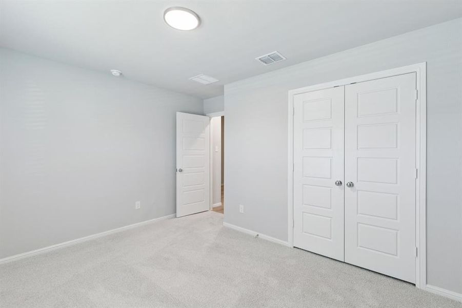 Bedroom in the Harrison home plan by Trophy Signature Homes – REPRESENTATIVE PHOTO Bedroom in the Harrison home plan by Trophy Signature Homes – REPRESENTATIVE PHOTO