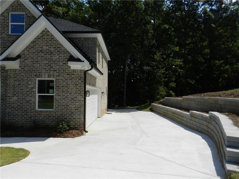 Front exterior of a new home in , McDonough, GA, highlighting curb appeal (Image 18).