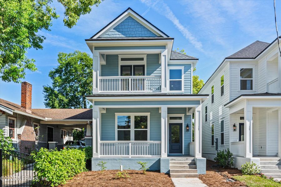 Front exterior of a new home in , Jacksonville, FL, highlighting curb appeal (Image 1).