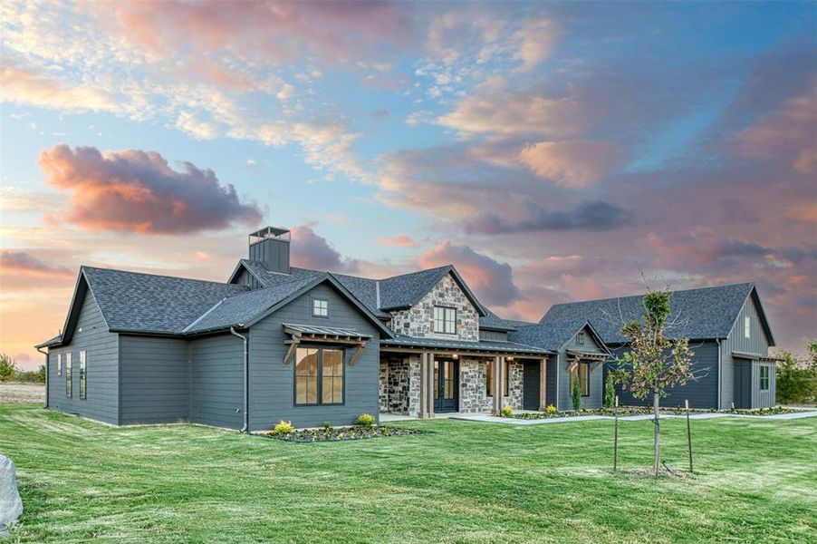 View of front of home featuring a lawn