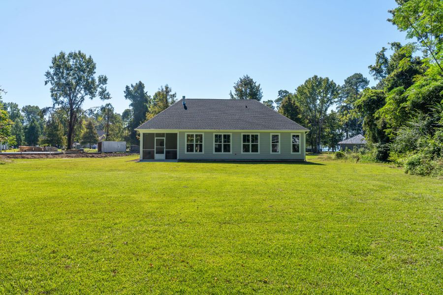 Exterior details and patio area of a home in The Bluffs at Lake Waccamaw, Lake Waccamaw (Image 27).