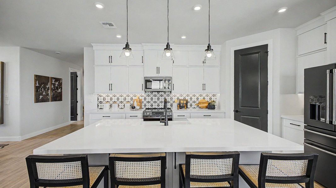Modern kitchen island in this quick move-in new home by DRB Homes at Saguaro Hills at Vistancia, 32407 N 123rd Dr. Modern kitchen island in this quick move-in new home by DRB Homes at Saguaro Hills at Vistancia, 32407 N 123rd Dr.