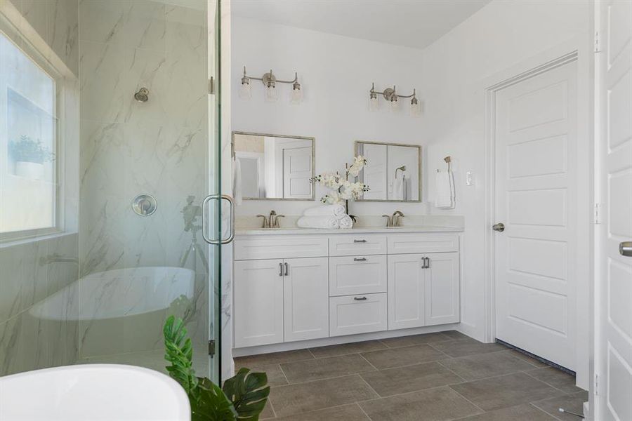 Bathroom featuring vanity, separate shower and tub, and plenty of natural light