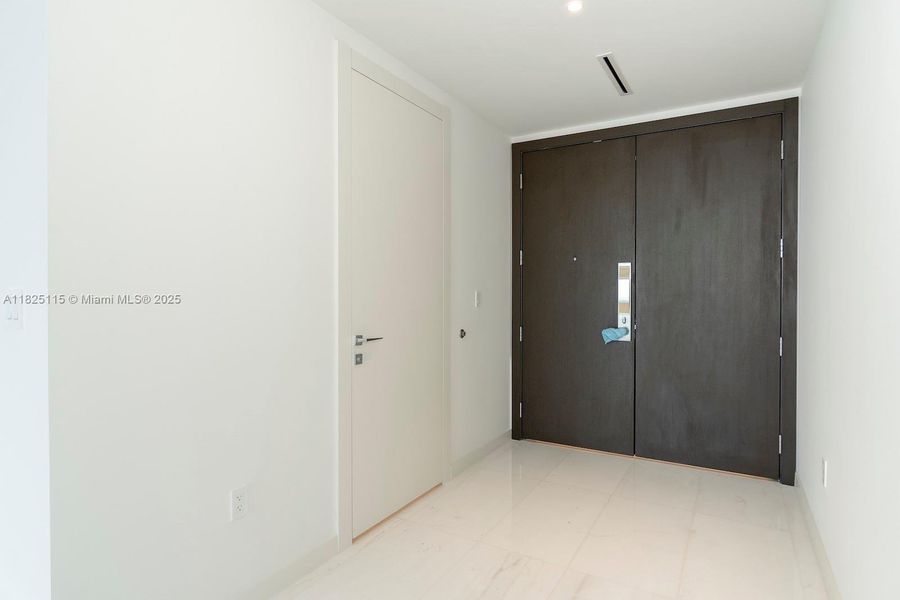 Spacious, unfurnished interior of a new home in Aston Martin Residences, Miami (Image 18).