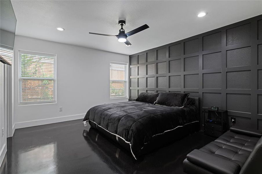 Bedroom with multiple windows and ceiling fan