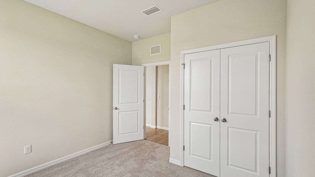 Representative unfurnished interior of a home built from the Hemingway by D.R. Horton in Silverstone North, Palmetto (Image 23).