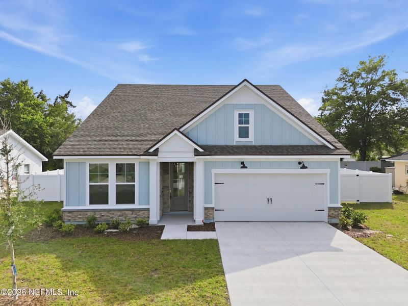 Front exterior of a new home in Palm Coast Homes, Palm Coast, FL, highlighting curb appeal (Image 29).
