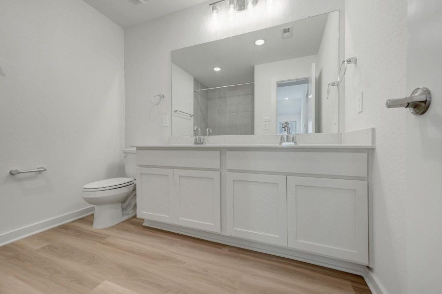 Furnished interior view inside a new home in Lone Star Landing, Montgomery (Image 18).