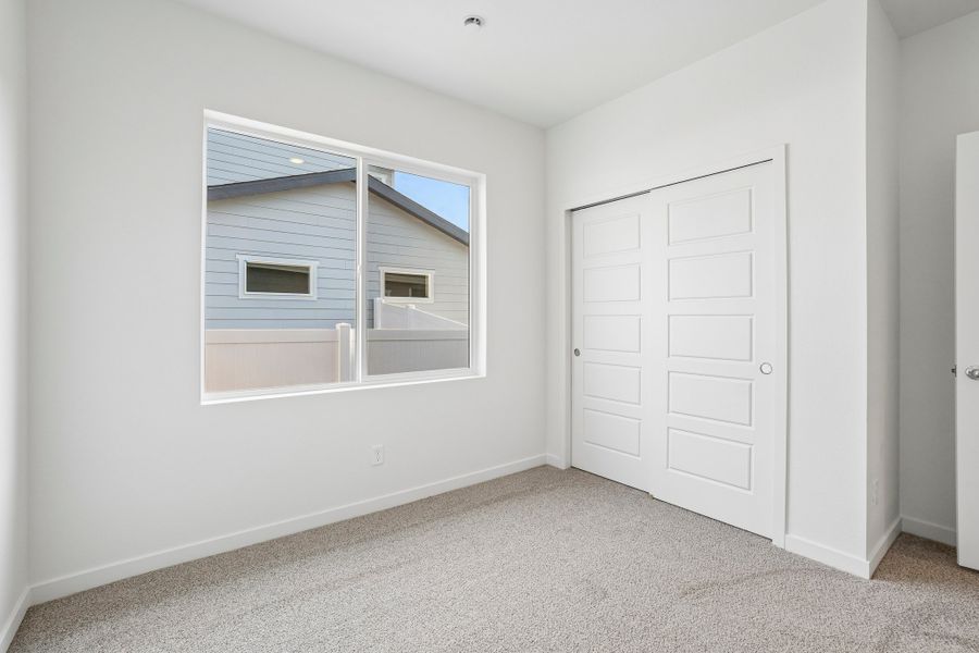 Spacious, unfurnished interior of a new home in Union Colony West, Greeley (Image 30).