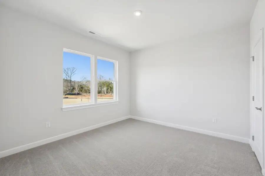 Spacious, unfurnished interior of a new home in The Townes at Willow Park, Cary (Image 10).