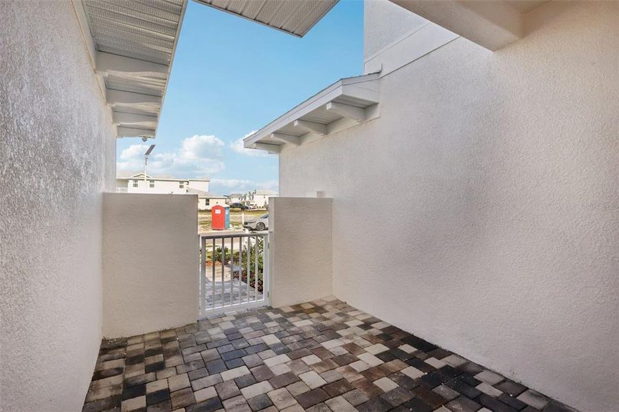 Exterior details and patio area of a home in Lagoon Residences at Epperson, Wesley Chapel (Image 13).