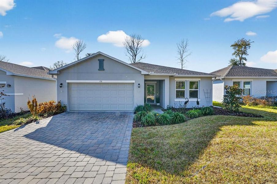 Front exterior of a new home in , Edgewater, FL, highlighting curb appeal (Image 21). Front exterior of a new home in , Edgewater, FL, highlighting curb appeal (Image 21).