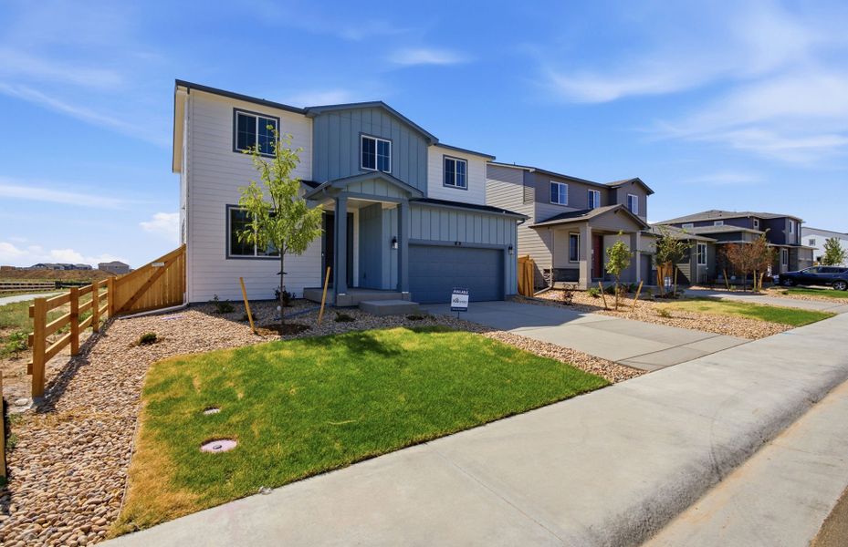 Front exterior of a new home in Murata Farms, Fort Lupton, CO, highlighting curb appeal (Image 22).