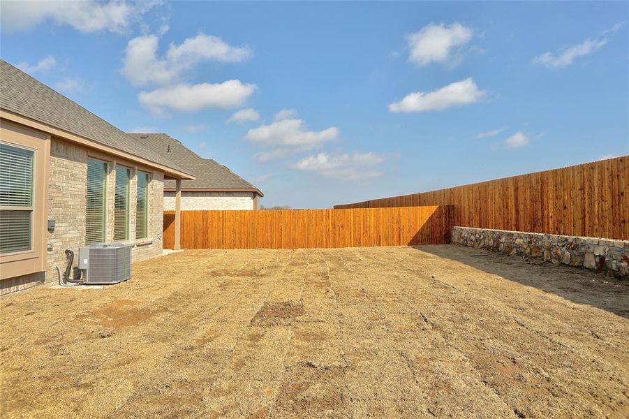 View of yard featuring central air condition unit