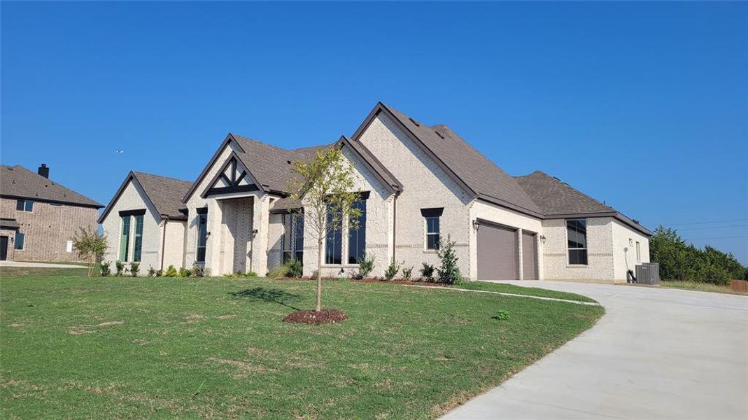 Front exterior of a new home in Sagebrush Addition, Midlothian, TX, highlighting curb appeal (Image 17).
