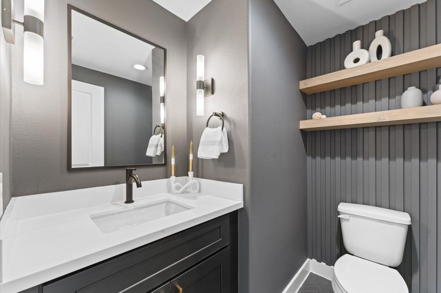 Half bath on second floor. Photos are from a previous NJA Homes development. Floor plan, finishes & specifications may vary.