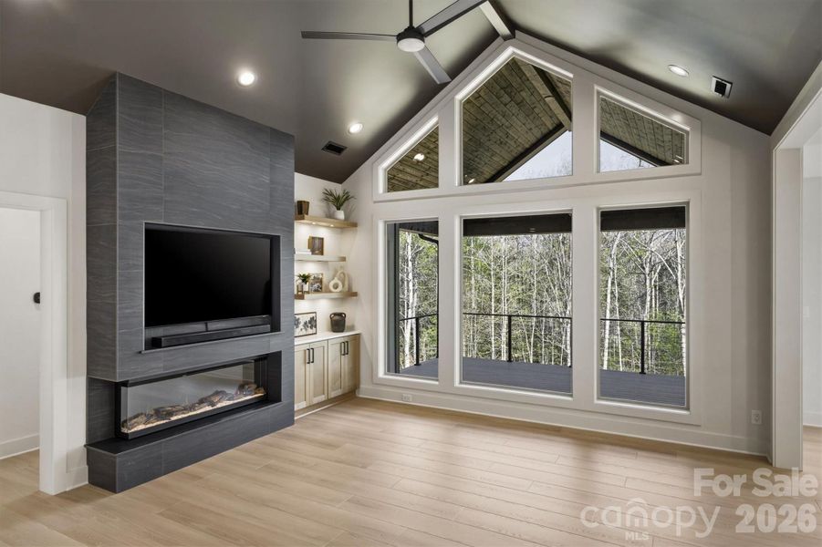 When you step further in to the room, the first thing you notice is the electric linear fireplace. Hanging over that is a 65" Samsung TV with a Dolby Atmos sound bar. This home has all the bells and whistles! When you step further in to the room, the first thing you notice is the electric linear fireplace. Hanging over that is a 65" Samsung TV with a Dolby Atmos sound bar. This home has all the bells and whistles!