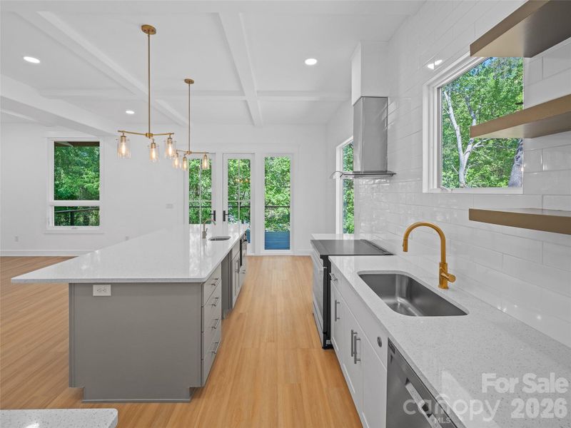 Main level kitchen and great room with doors to back deck