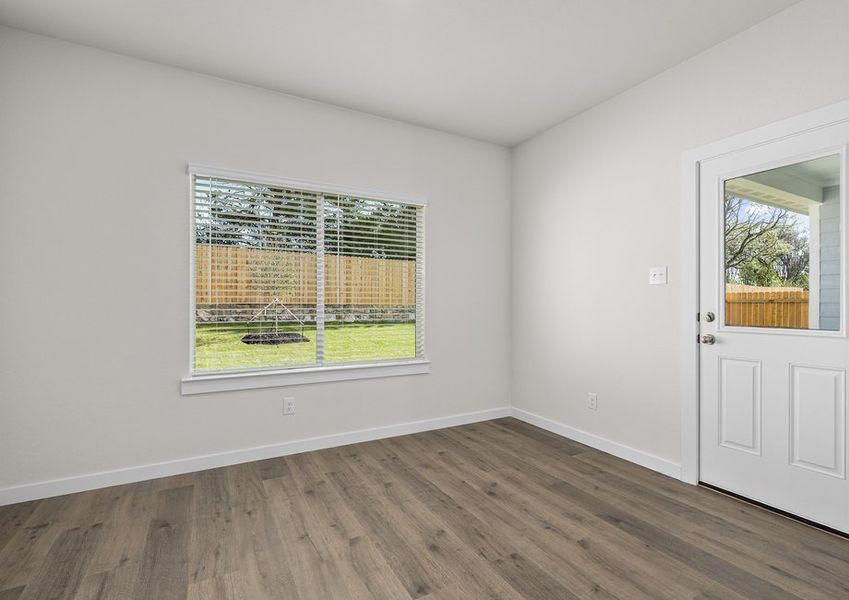 The dining room has large windows that let in great, natural light.