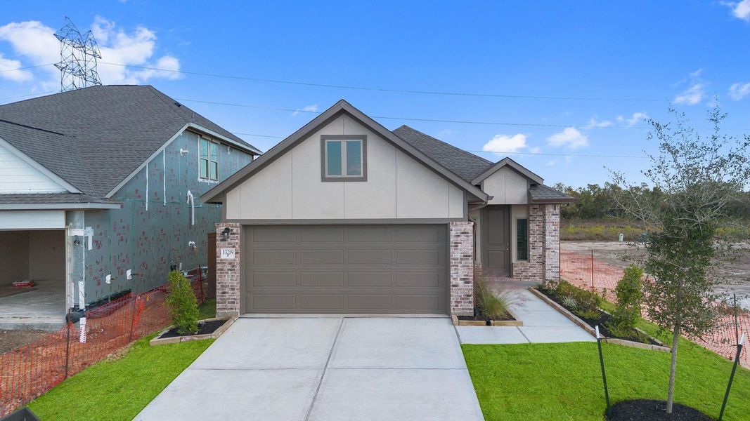 Front exterior of a new home in Creekhaven, Rosharon, TX, highlighting curb appeal (Image 15).