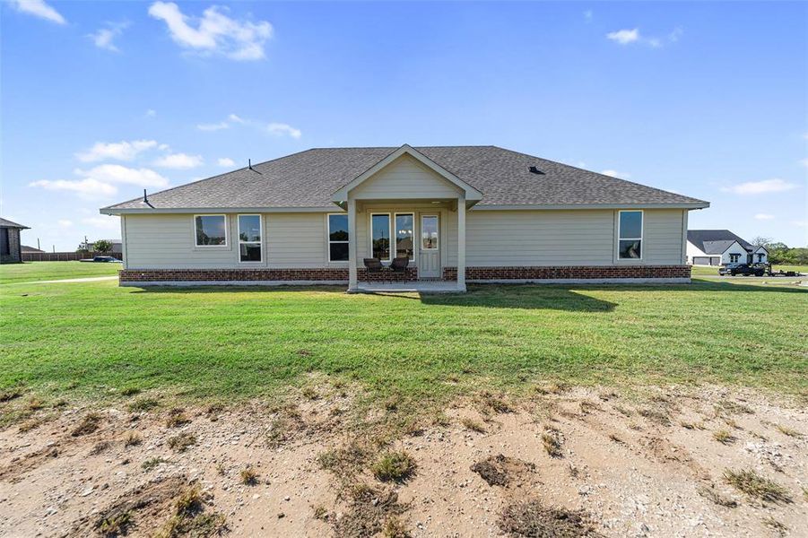 Exterior details and patio area of a home in Nash Estates, Tom Bean (Image 24).