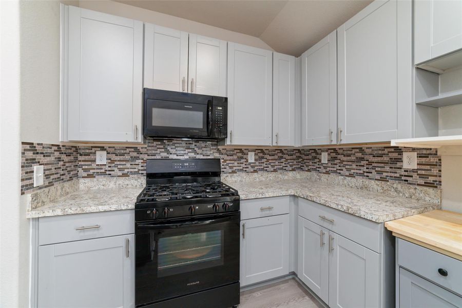 Well-designed kitchen with generous cabinet space and a clean, open feel, creating an easy flow for everyday living.