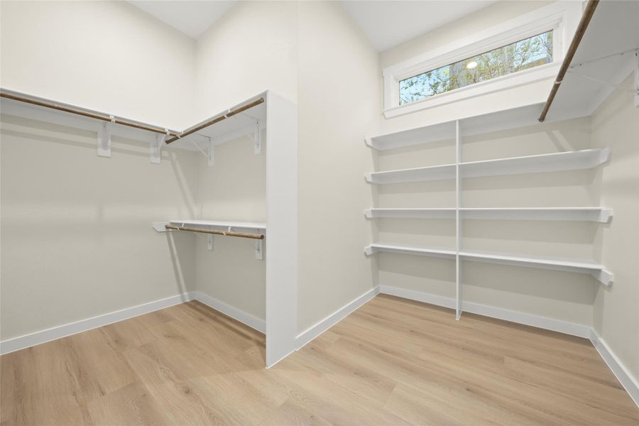 Oversized Primary closet with natural light Oversized Primary closet with natural light