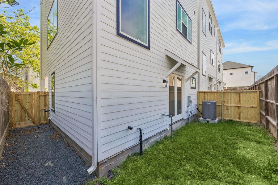 Securely enclosed backyard with gated access, complemented by a charming pebbled side yard for added privacy and low-maintenance appeal. Securely enclosed backyard with gated access, complemented by a charming pebbled side yard for added privacy and low-maintenance appeal.