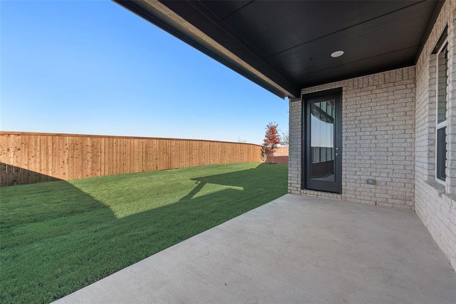 Exterior details and patio area of a home in Wildflower Ranch, Justin (Image 3). Exterior details and patio area of a home in Wildflower Ranch, Justin (Image 3).