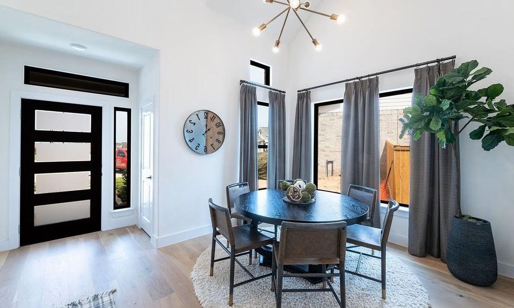 What a lovely spot to gather and enjoy! This open and inviting dining area is perfectly positioned near the entry and kitchen, featuring stunning wood looking tile flooring that adds warmth and continuity, creating a comfortable setting for everyday meals, casual gatherings, and easy conversation.. **Photos are representative only and may vary as built.**