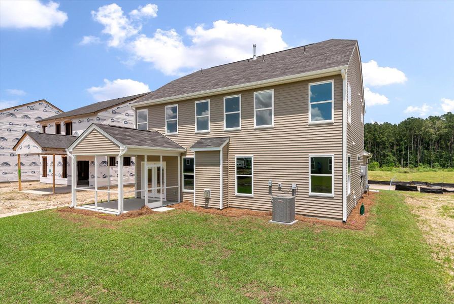 Front exterior of a new home in Oakley Pointe, Moncks Corner, SC, highlighting curb appeal (Image 22).