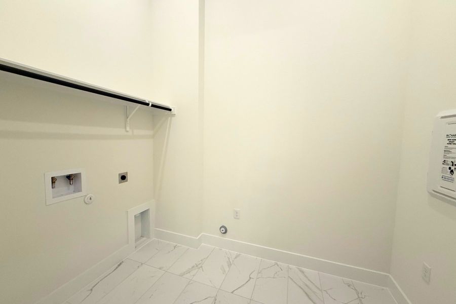 Spacious, unfurnished interior of a new home in The Grove at Blackhawk, Pflugerville (Image 28).