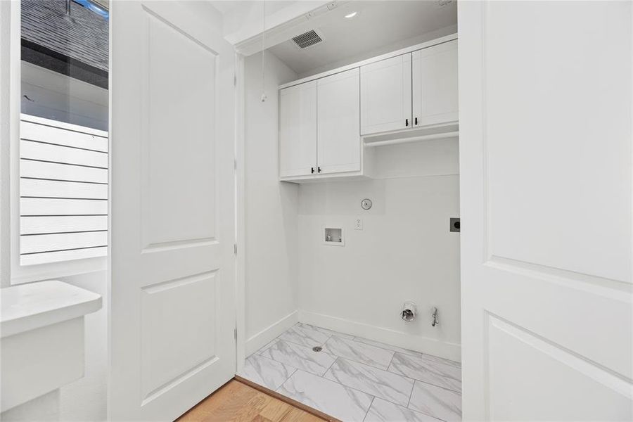 The utility room is conveniently located on the 3rd level.