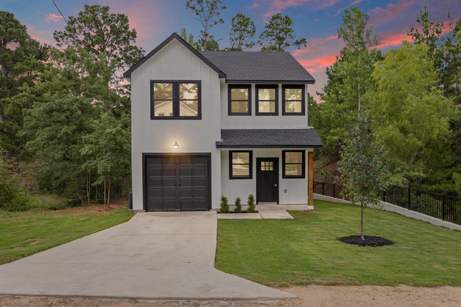 View of front of house featuring a shingled roof, an attached garage, concrete driveway, and board and batten siding View of front of house featuring a shingled roof, an attached garage, concrete driveway, and board and batten siding