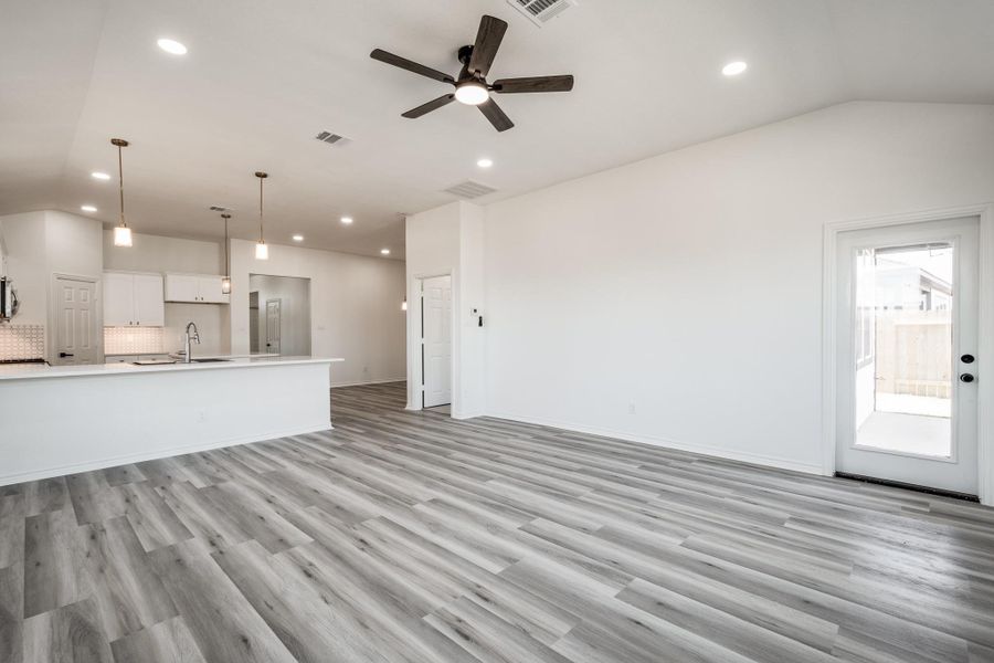 Living area showing open concept to Kitchen. Living area showing open concept to Kitchen.