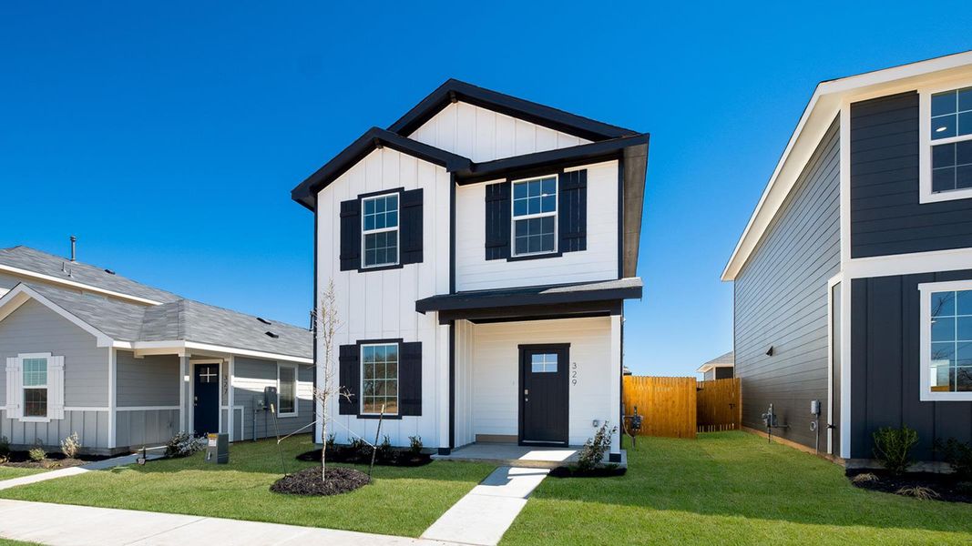 Front exterior of a new home in Valverde, Bastrop, TX, highlighting curb appeal (Image 15).
