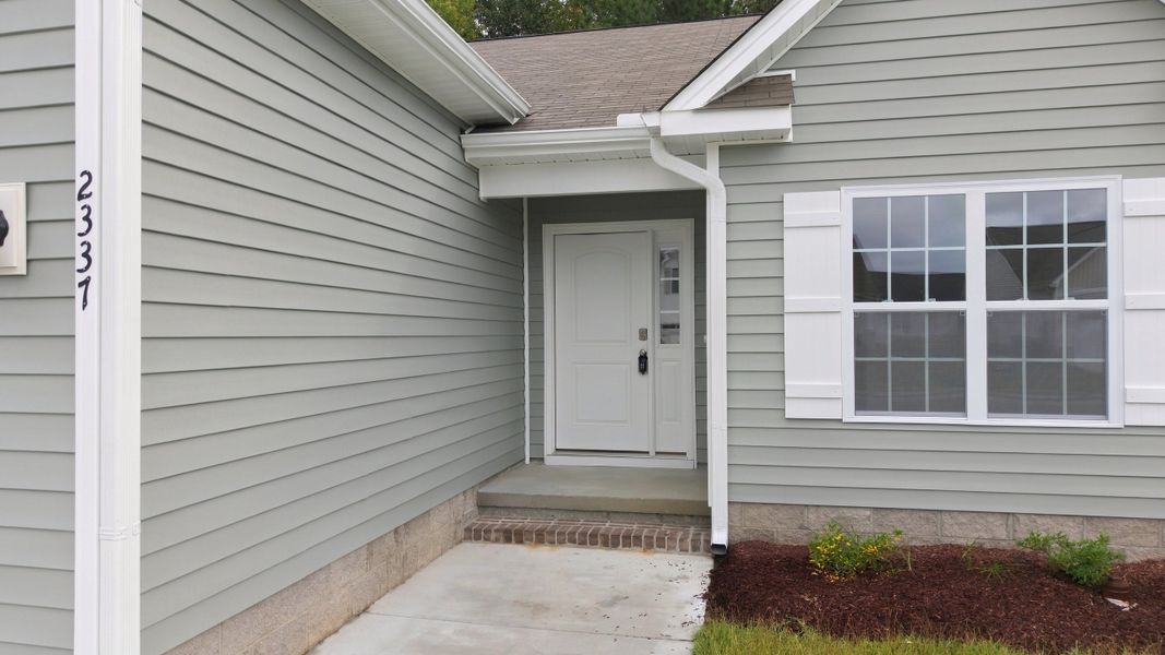 Exterior details and patio area of a home in Davenport Farms, Winterville (Image 26).