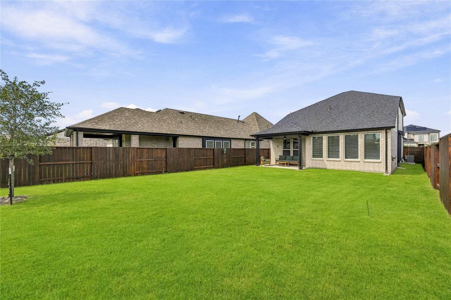 The spacious backyard creates an inviting setting for outdoor living, with plenty of room for weekend barbecues, gardening or relaxed evenings. The spacious backyard creates an inviting setting for outdoor living, with plenty of room for weekend barbecues, gardening or relaxed evenings.