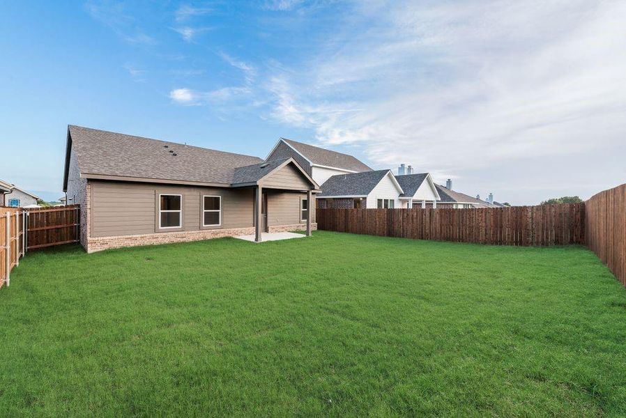 Front exterior of a new home in Liberty Pointe, Gainesville, TX, highlighting curb appeal (Image 14).