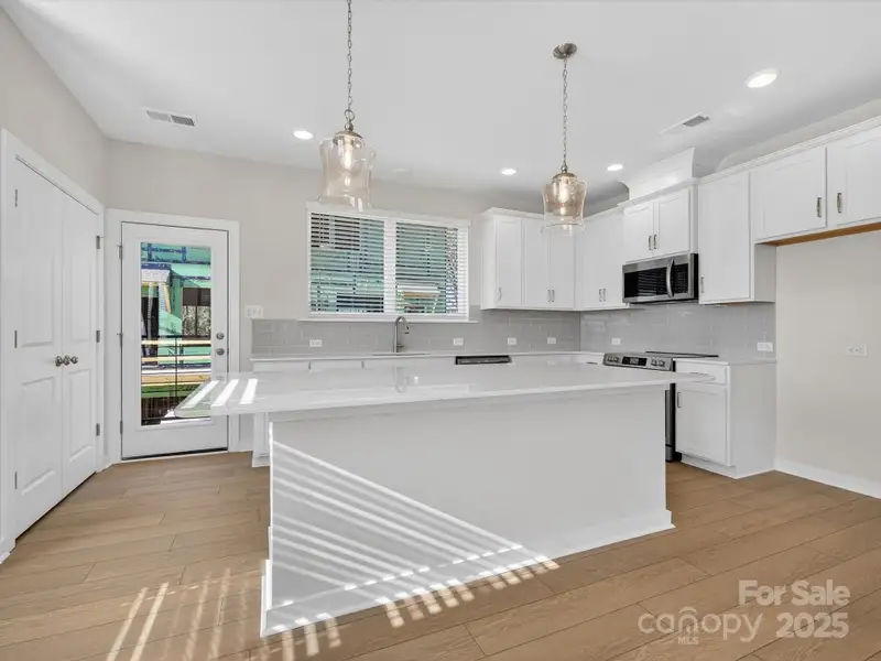 Furnished interior view inside a new home in Central Living at Craig, Charlotte (Image 6).