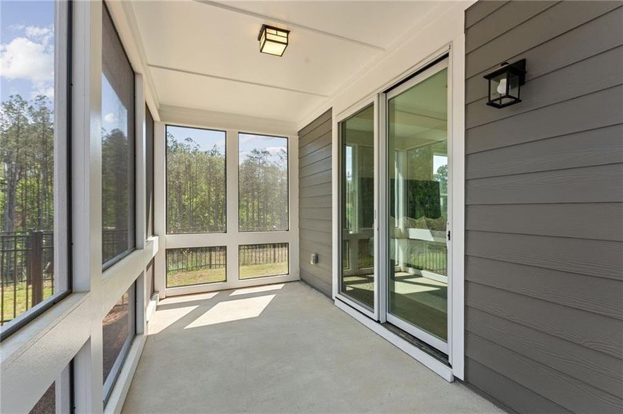 Exterior details and patio area of a home in The Courtyards at Bailey Farms, Dacula (Image 18).